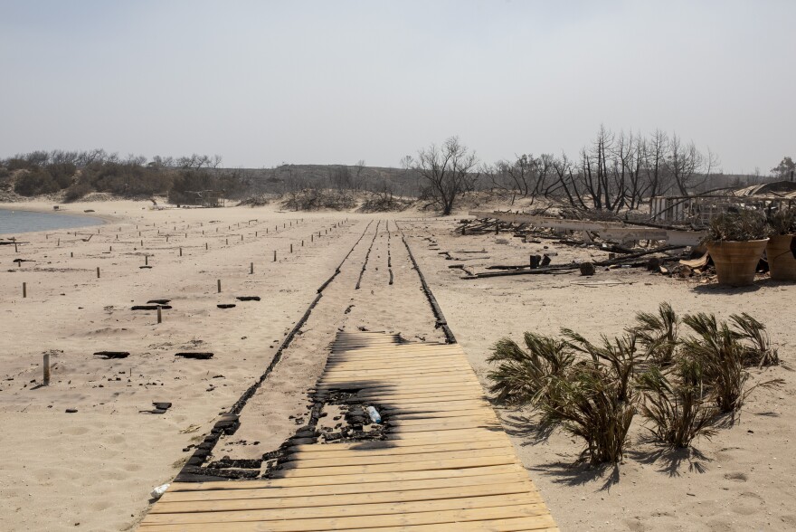 July 24, 2023: A burnt beach bar can be seen near the village of Kiotari. Forest fires rage on Rhodes and in other parts of Greece.