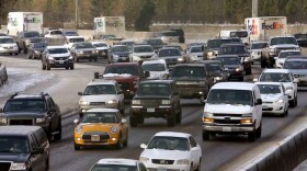 FILE - Traffic moves along Highway 26 heading into Portland, Ore. Hundreds of workers at the Oregon Department of Transportation are anticipating layoffs as soon as Monday, July 7, 2025.