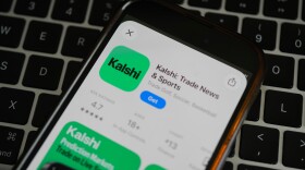FILE - An ad for the prediction market app Kalshi is displayed on a mobile phone.