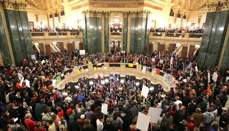 Thousands of protesters swarm the Capitol in Madison, Wis., on Wednesday after Republican senators voted to curb collective bargaining rights for some public union workers.