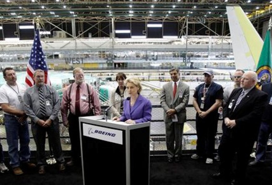 Gov. Chris Gregoire speaks Tuesday at the Boeing Co. assembly facility in Renton. Gregoire announced $3 million in funding to help workers develop the skills needed by aerospace employers such as Boeing.