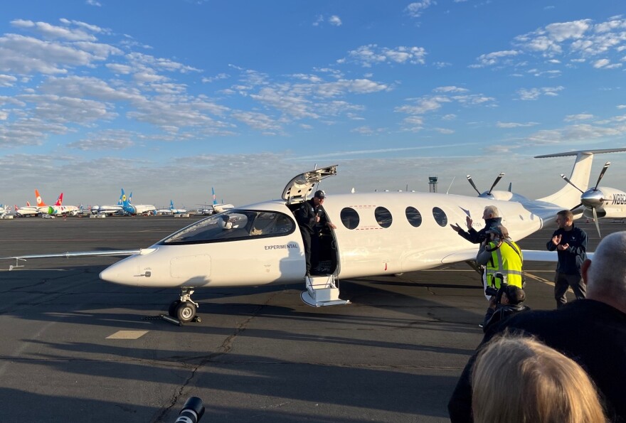 Test pilot Steven Crane emerges from the Alice prototype after a successful maiden flight on September 27.