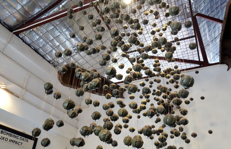 An exhibit of "bombies," or cluster submunitions, at the visitor center for the nonprofit COPE. An estimated 30 percent of bombs dropped on Laos by U.S. forces during the Vietnam War failed to explode, so they continue to cause casualties today.