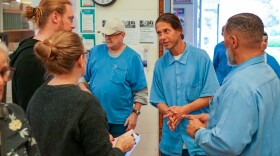 Kelton O'Connor explains his program to a group of visitors and incarcerated people during a media and arts event at San Quentin. Kelton helped found an environmental group inside prison called Earth Equity.