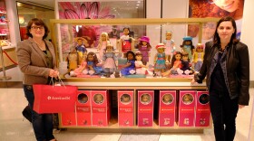 Allison Horrocks (right) and Mary Mahoney (left) stand next to an exhibition of American Girl dolls. (Photo courtesy of Horrocks and Mahoney)