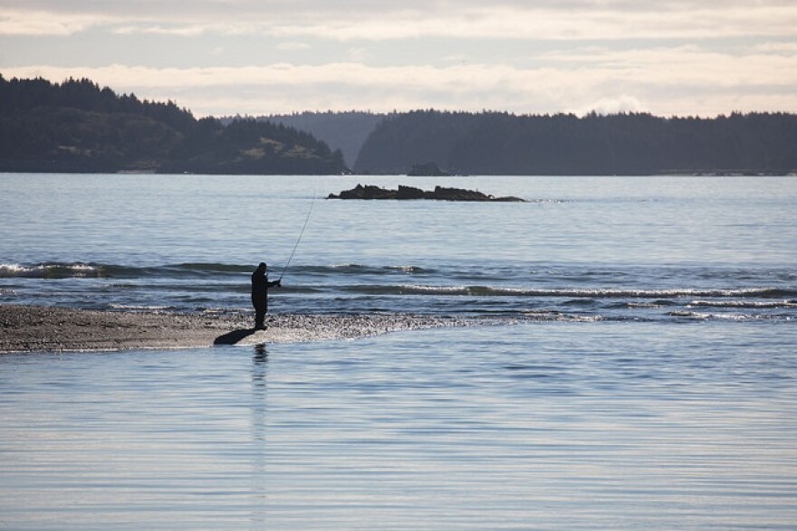 A fisherman at the mouth of the Buskin River. (Photo by Lisa Hupp/USFWS)