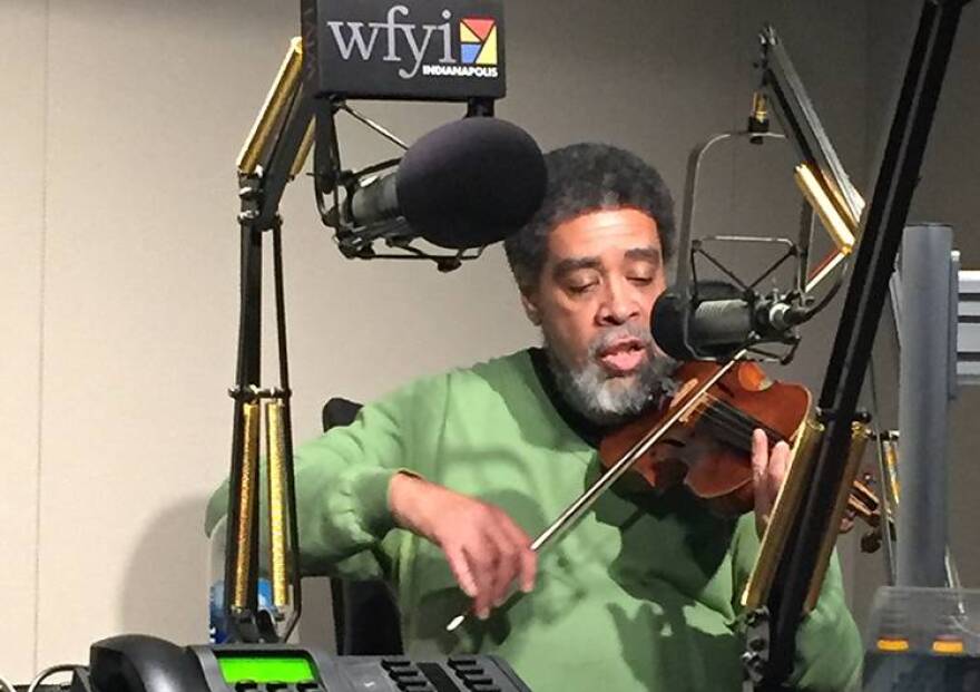Jesse Hawkins plays his violin in the WFYI studio.