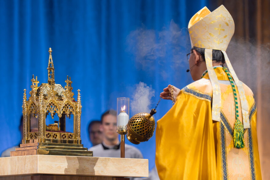 Cardinal Luis Antonio Tagle incenses a reliquary containing a portion of the late Archbishop Fulton J. Sheen's jawbone during Sheen's beatification Mass on Thursday.