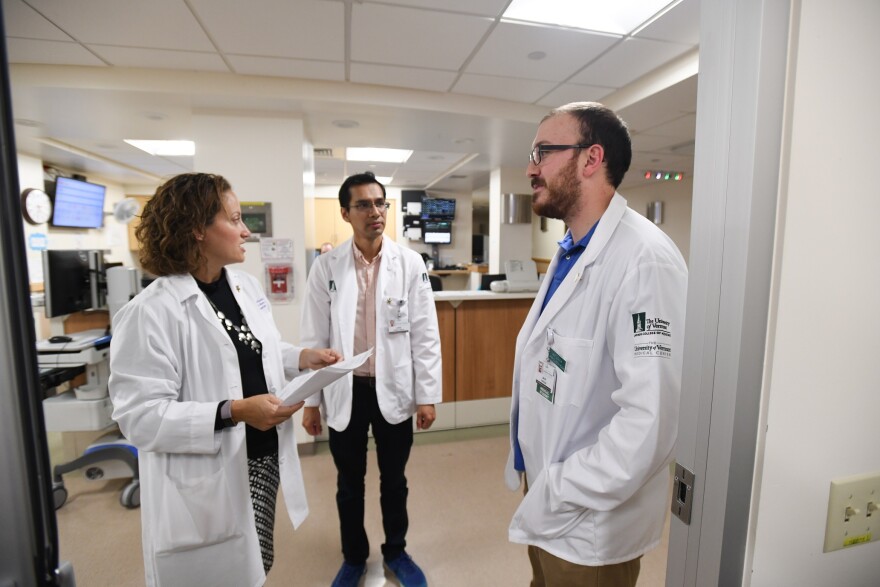 Class of 2021 UVM Larner College of Medicine student Juan Conde, center, with Assistant Professor of Medicine and Assistant Dean for Students Shaden Eldakar-Hein, M.D. (left) and Class of 2021 medial student Jack Dubuque, at the UVM Medical Center in Octo