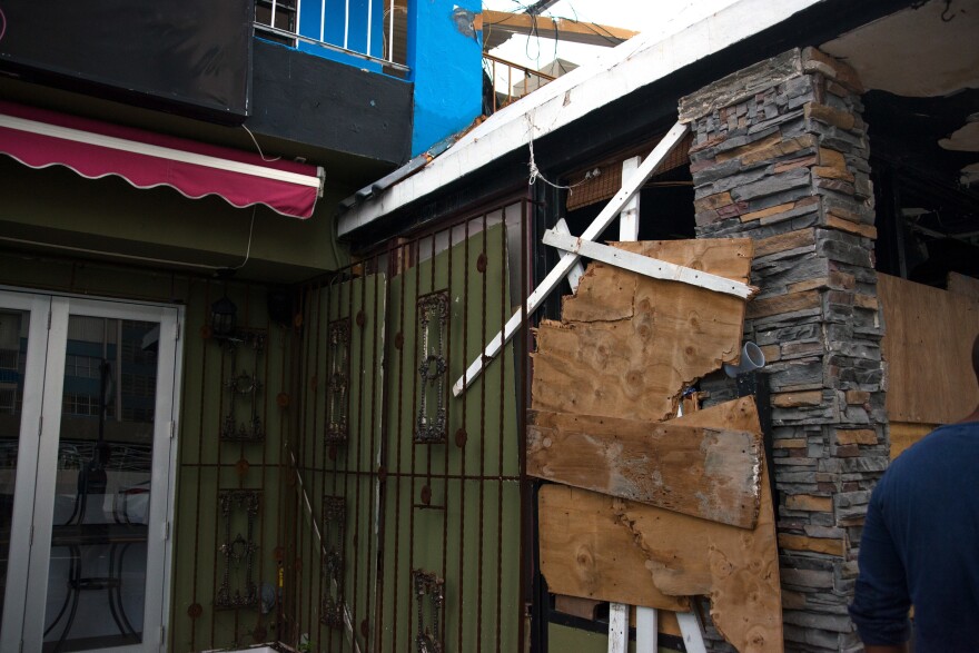 Before the hurricane, Sanchez tried to cover up the walls with plywood. It helped salvage the ironwork and glass doors but he has no idea where his patio fence went.
