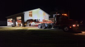 Late evening on November 9, David DeVooght's crew move a pole barn a few miles north of the Vantage data center site.