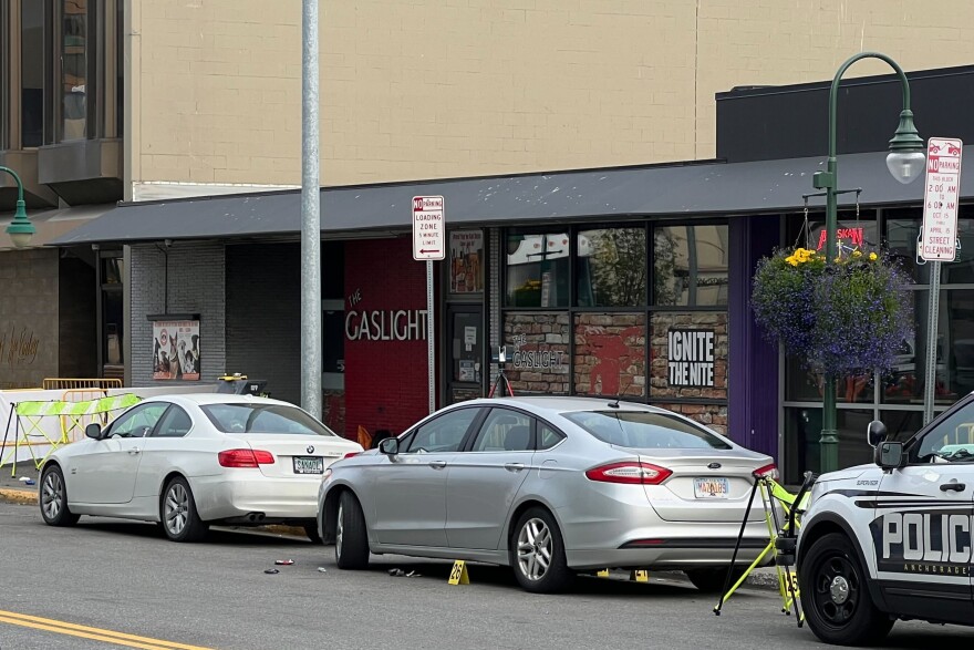 cars parked outside of a bar