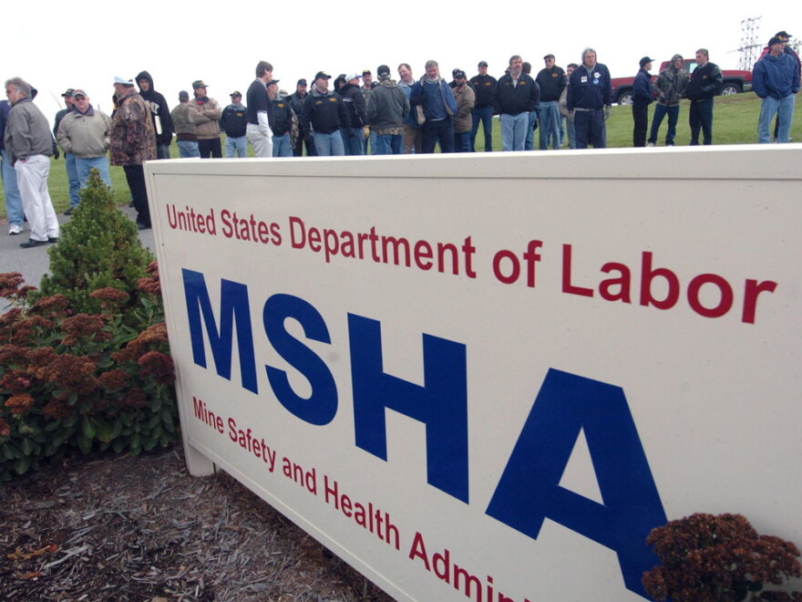 About 100  miners from Pennsylvania and West Virginia stand outside the Mine Safety and Health  Administration's Morgantown,  W.Va., office Oct. 24, 2006, waiting  to meet with officials to demand stronger mine safety inspections and  regulations.
