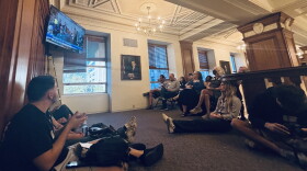 Watchers gather in the overflow area outside council chambers as speakers line up to discuss data centers.