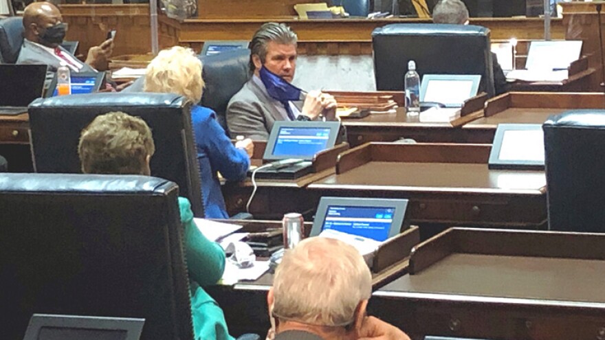 Indiana Senate Appropriations Committee Chairman Ryan Mishler, center speaks with a fellow senator during an April 1, 2021, Senate session at the Indiana Statehouse in Indianapolis.