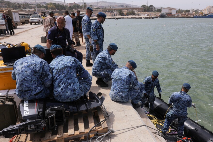 An Italian search and rescue team drops a boat during a search mission in Derna following fatal floods, Sept. 17.