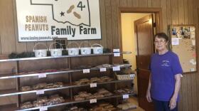 Zelma Lasley stands by shelves of peanuts and sweets at the family's farm in Eakly, Oklahoma. The peanuts are typically sold at the Oklahoma State Fair in the Made in Oklahoma Booth. 