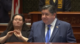 Gov. J.B. Pritzker delivers his speech in the Illinois House chamber on Feb. 21, 2024