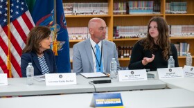 Brigid Gill, a soon-to-be senior in the North Syracuse school district, speaks during a roundtable discussion on implementing a ban on cell phone use in schools. To her right are Gov. Kathy Hochul and North Syracuse