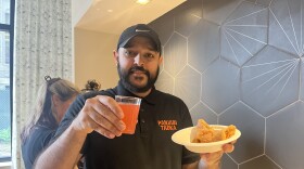 Harshman Singh, owner of downtown Springfield Indian restaurant, Punjabi Tadka, holds up a rose lemonade and egg roll stuffed with chili paneer as special menu item for Springfield Restaurant Week.