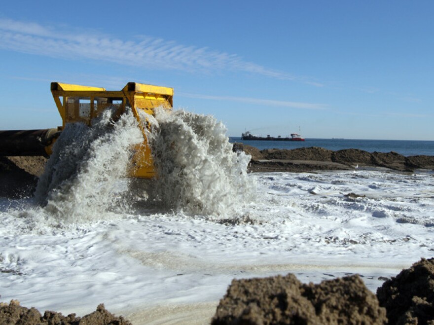 Workers reconstruct a section of Virginia Beach. The federal government finances 65 percent of beach nourishment projects; local governments pay for the rest.