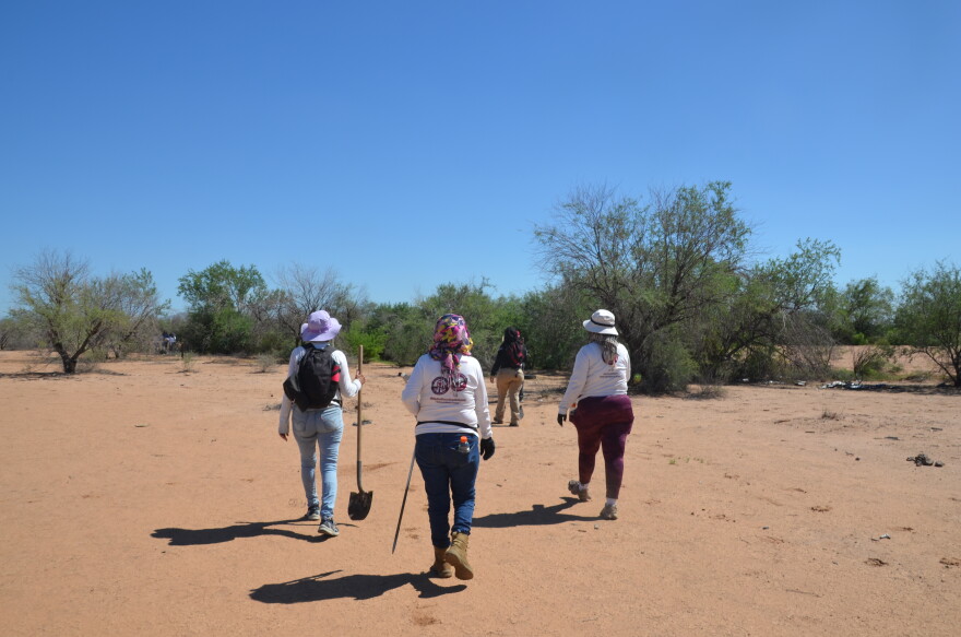 A group of Madres Buscadoras de Sonora treks through the desert in the outskirts of Hermosillo to search for the remains of their missing children.
