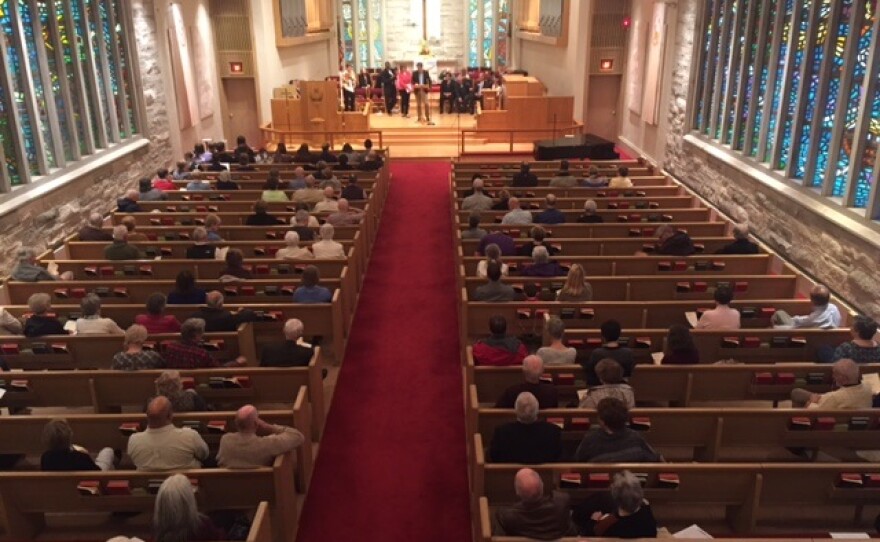 Second-floor choir loft view of the gathering at First United Methodist Church in Normal
