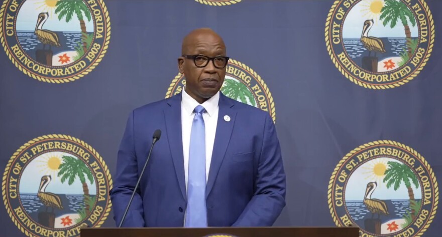 Ken Welch speaking at the podium