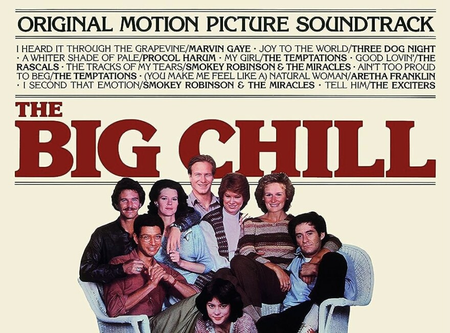 The cast of "The Big Chill" is clustered around wicker chairs.