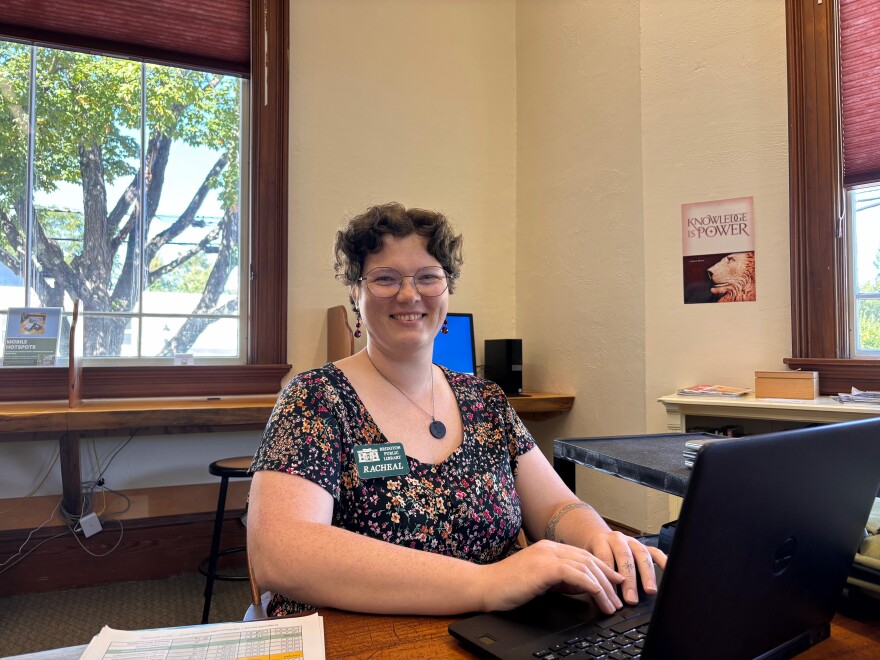 Racheal Sylvester is the outreach coordinator at Bridgton Public Library. She sits at a table during her Tech Assistance hour where she helps patrons use computers.