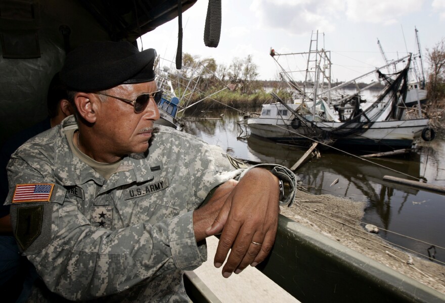 Army Lt. Gen. Russel Honore looks over extensive flood damage from Hurricanes Katrina and Rita in the town of Empire in Plaquemines Parish, La., on Oct. 1, 2005. Hurricane Rita hit a little less than a month after Katrina, and much of the area remained flooded.