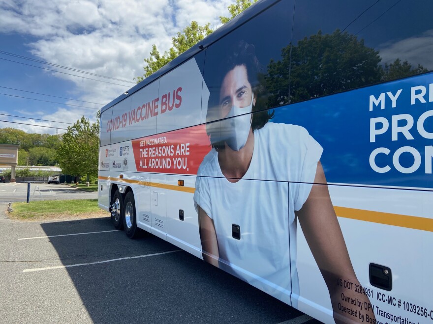 A bus, shown here in Chicopee, Massachusetts, has been converted into a mobile vaccination site. The seats on the bus were removed to make room for four vaccination wells, where nurses give the shots.