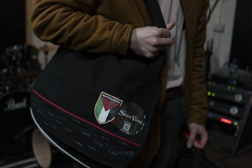 A pro-Palestinian badge can be seen on the bag of Breandan McGlone, lead guitarist for The Shan Vans, an Irish-language rock band, during a practice session at the Blackstaff Mill music studios in West Belfast, Northern Ireland, on Feb. 9.