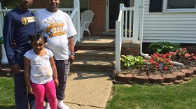 Jalin, Valencia and Irmitha Pitchford in front of their new home in Wyandotte.