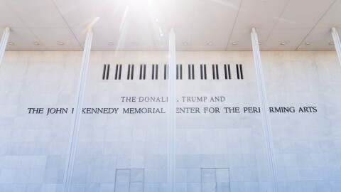 Passersby look at the John F. Kennedy Center for the Performing Arts signage, Friday, May 29, 2026, in Washington. (AP Photo/Julia Demaree Nikhinson)