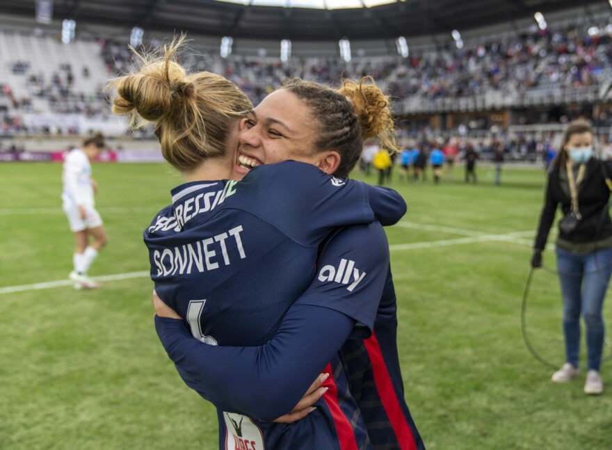 Trinity Rodman celebrates with teammate Emily Sonnett