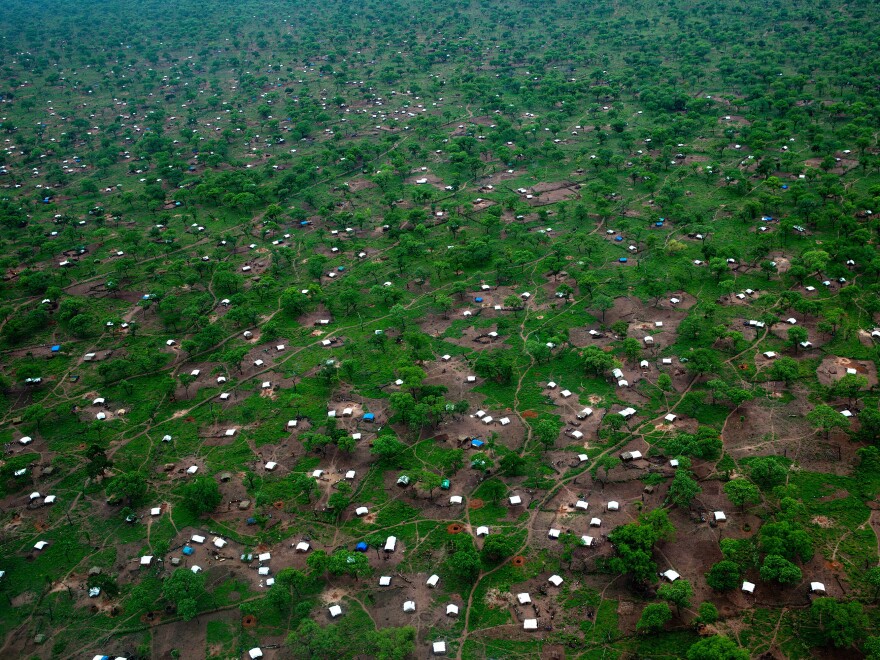 White tents scatter across the Yida refugee camp along northern border of South Sudan on June 29. The international aid community is struggling to provide food and medical supplies to the families after heavy rains blocked roads to the camp.