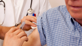 Man receiving vaccine injection 