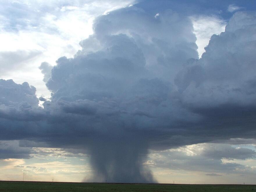 A convection cell from a North American monsoon thunderstorm brings wind and rain.