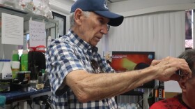 Manuel Moya cuts hair at his barber shop 'Moya Cotorro' in Hialeah. He said President Donald Trump has a historic chance to change history by forcing regime change in Cuba.