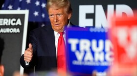 Republican presidential nominee former President Donald Trump poses for a photo with Rep. Lauren Boebert, R-Colo., before he speaks at a campaign rally at the Gaylord Rockies Resort & Convention Center Oct. 11, 2024, in Aurora, Colo.