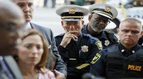 Members of the Cincinnati Police Department listen as Chief Eliot Isaac speaks after a shooting near Fountain Square, Thursday, Sept. 6, 2018, in downtown Cincinnati.