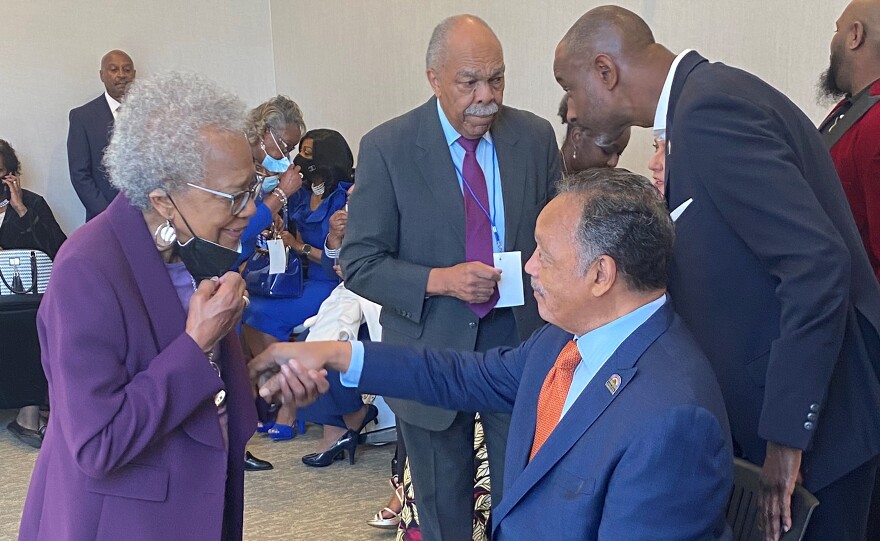 Peggy Baxter, in purple, greets the Rev. Jesse Jackson in Greenville in 2024. Baxter and Jackson worked on the effort to get MLK Day recognized as a holiday in Greenville County.