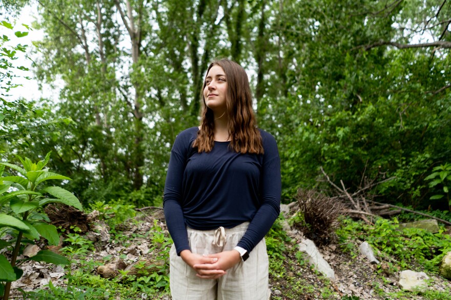 Emma Heienickle, a recent University of Missouri graduate in environmental and atmospheric science, on Tuesday, May 24, 2022, at Katy Trail State Park in Weldon Springs. “God created the world and because we love God, we should take of what He made and what He wants us to enjoy,” she said. “I relate God to someone I have a lot of peace and joy with, so when I’m outside I find a lot of joy. That’s why I connect the two so much.”