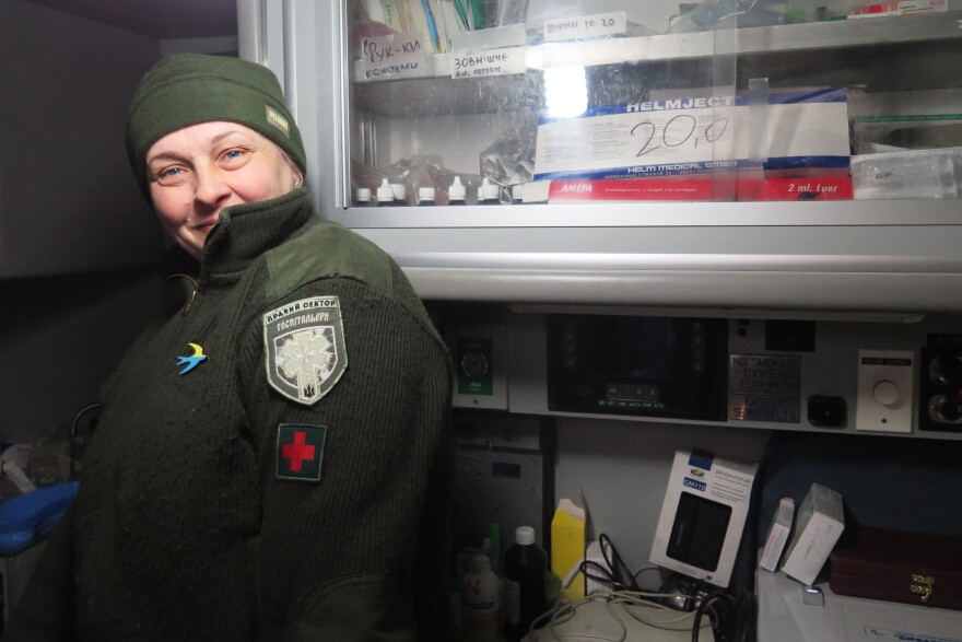 "Mama," like many members of the Right Sector militia in Ukraine's Pisky village, goes only by her nickname. She stands inside the donated American ambulance that serves as a medical station for wounded troops.