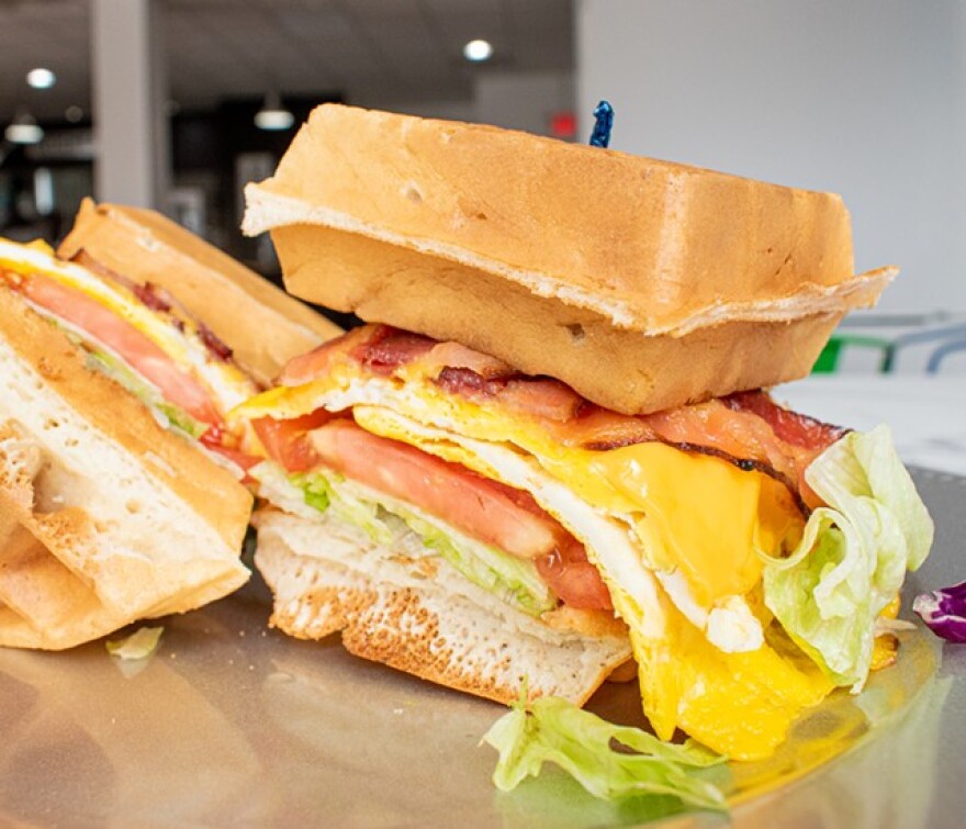 Wafflewich with bacon, cheese, lettuce, and tomato.