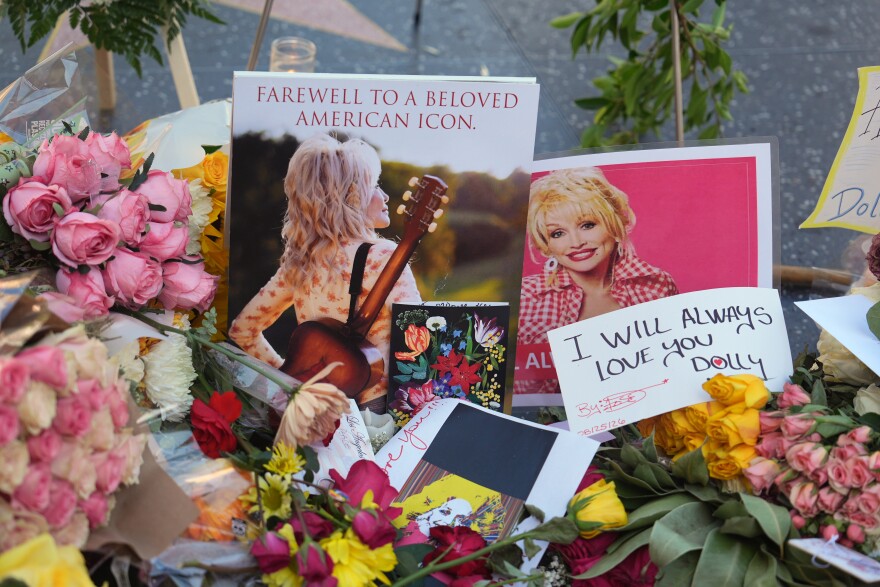 Flowers, notes and photos are left on Dolly Parton's star on the Hollywood Walk of Fame on Wednesday, Aug. 26, 2026, in Los Angeles.