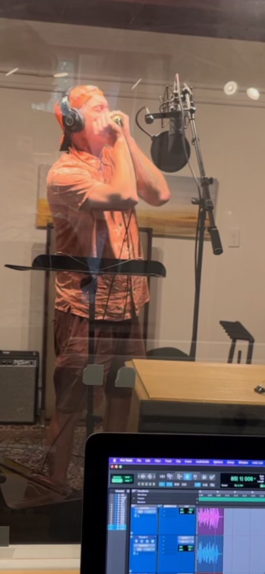 Garrett Dutton, better known as G. Love, records harmonica in his studio for “Good Morning, Good Afternoon, Good Night.”