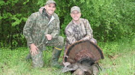 Kyle Allen, a Virginia state law enforcement officer, and Capt. Jacob Johnson, Marine Corps Systems Command, pose with a 20-pound turkey Johnson shot during a hunt at a Virginia Marine Corps base in 2016.