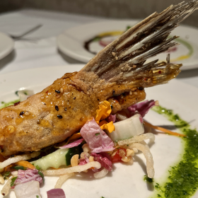 Fins wings are fried fish collars at GW Fins restaurant.